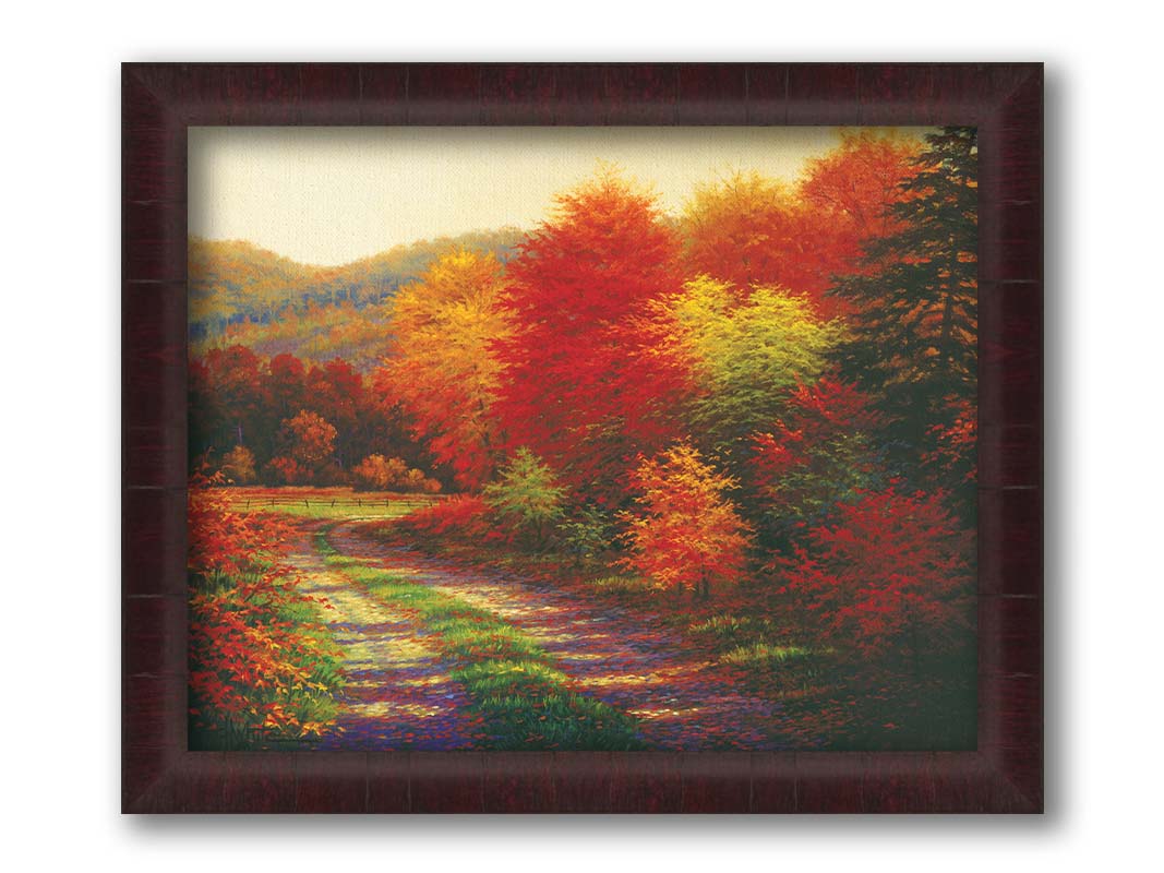 A painting of a forest in autumn, cut through by a gravel road curving into the distant fields and hills. Printed on canvas and framed.