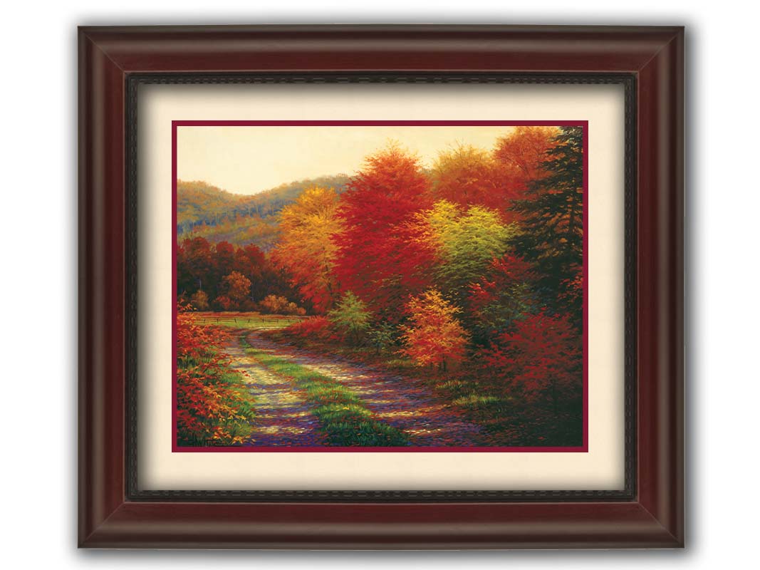 A painting of a forest in autumn, cut through by a gravel road curving into the distant fields and hills. Printed on paper, matted, and framed.