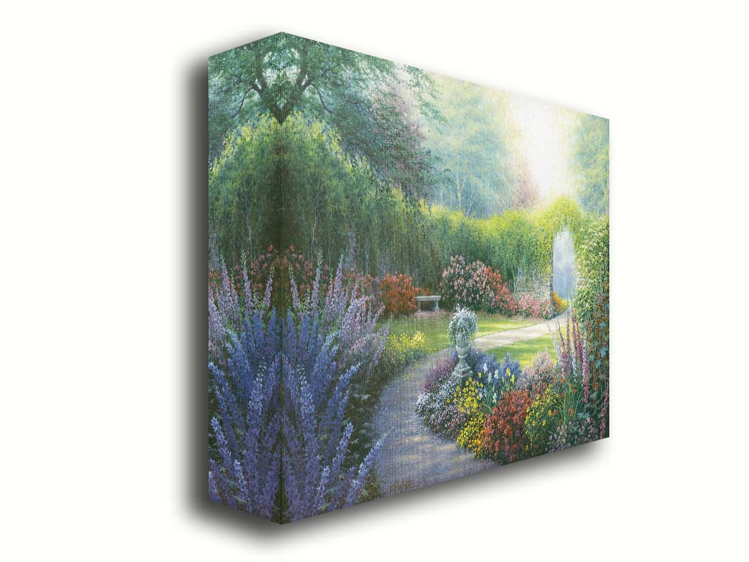 A painting of a path through a garden, filled with flowers in every color– including irises, foxgloves, butterfly bush, and more. A vine-covered stone wall with an archway surrounds the area. Printed on canvas.