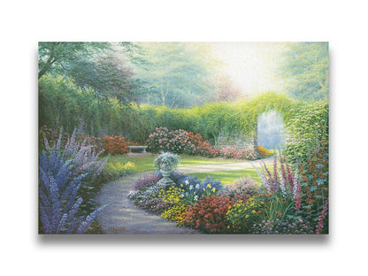 A painting of a path through a garden, filled with flowers in every color– including irises, foxgloves, butterfly bush, and more. A vine-covered stone wall with an archway surrounds the area. Printed on canvas.