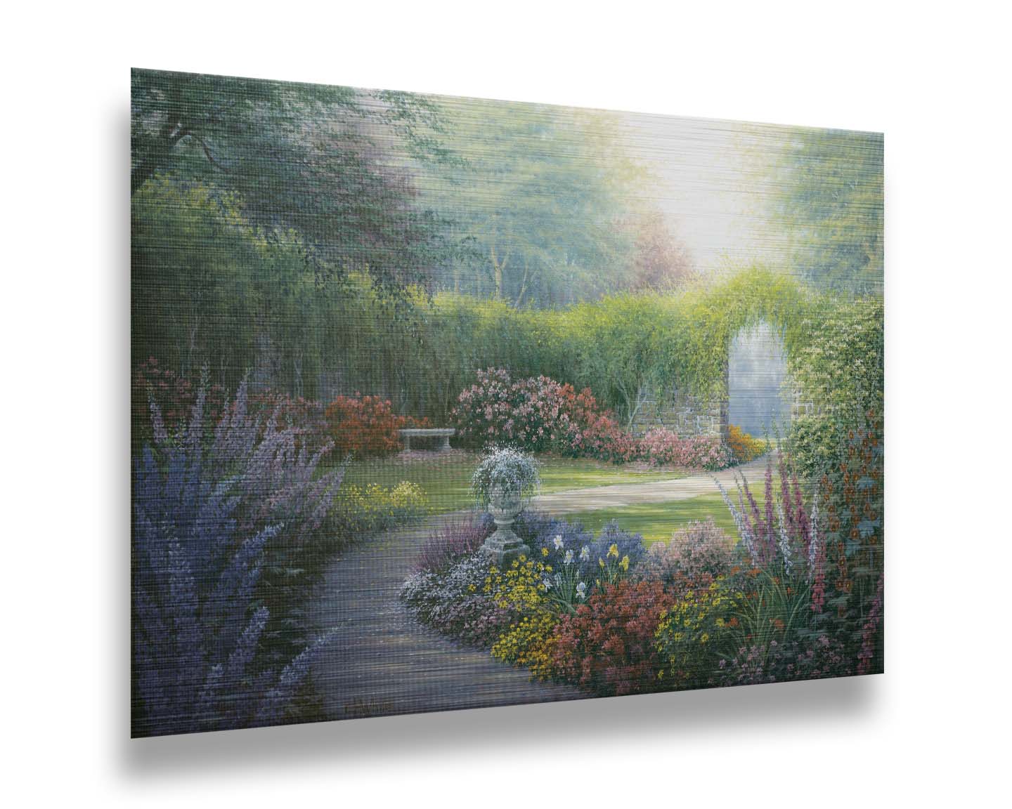 A painting of a path through a garden, filled with flowers in every color– including irises, foxgloves, butterfly bush, and more. A vine-covered stone wall with an archway surrounds the area. Printed on metal.