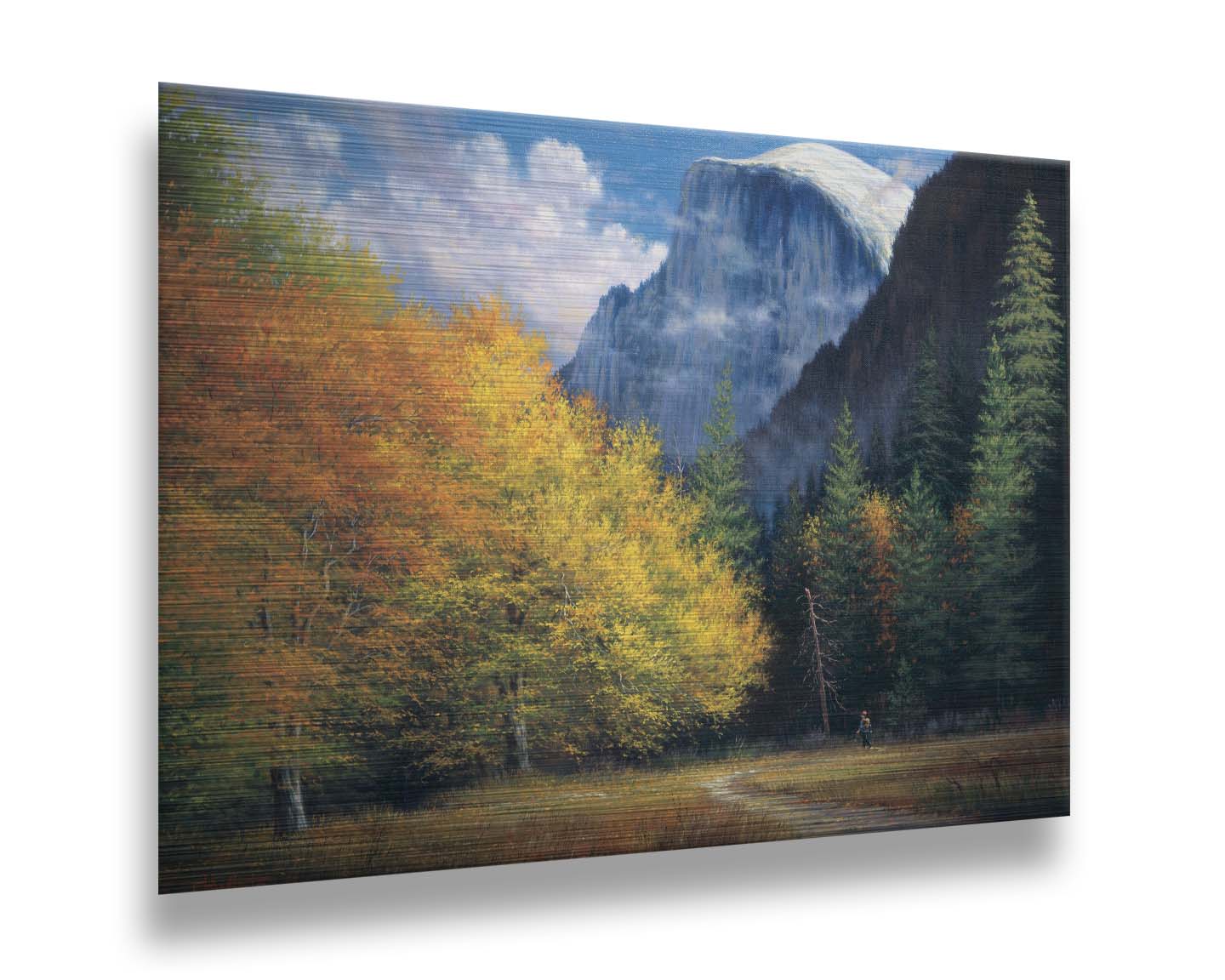 A painting of Yosemite National Park, with the iconic Half Dome batholith surrounded by wispy clouds. The fall foliage lines the trail to the summit. Printed on metal.