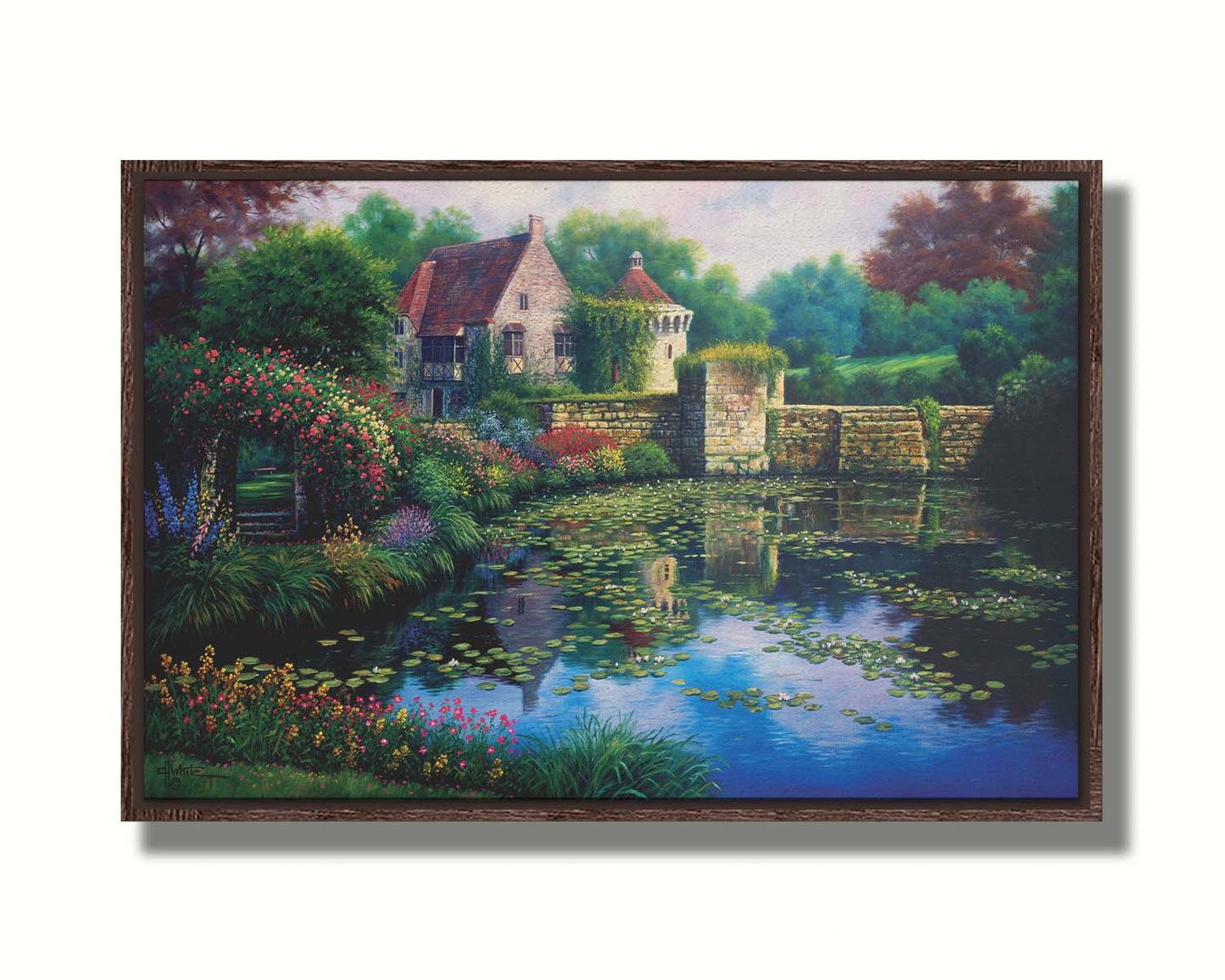 A painting of a pond covered in lily pads– bordered by a garden of flowers in every color, as well as an old stone wall covered in mosses and vines. Beyond it is a home with historic architecture, also supporting vines. The plants and structures are all well-maintained and not overgrown. Printed on canvas in a float frame.