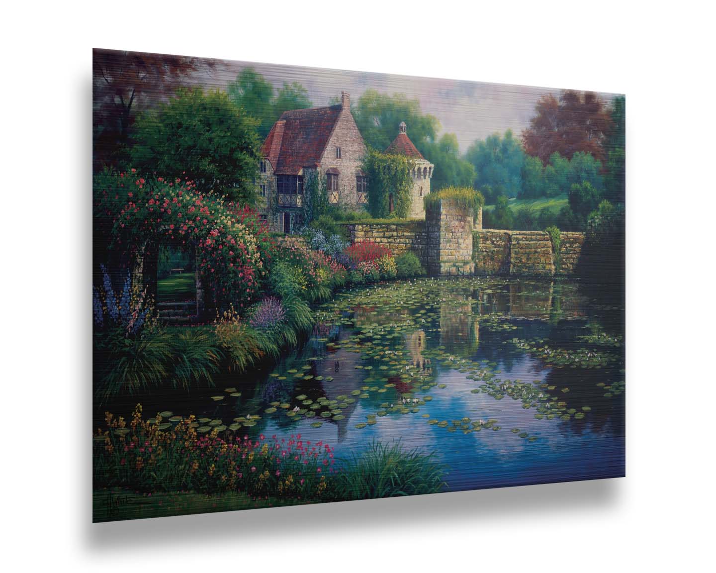 A painting of a pond covered in lily pads– bordered by a garden of flowers in every color, as well as an old stone wall covered in mosses and vines. Beyond it is a home with historic architecture, also supporting vines. The plants and structures are all well-maintained and not overgrown. Printed on metal.