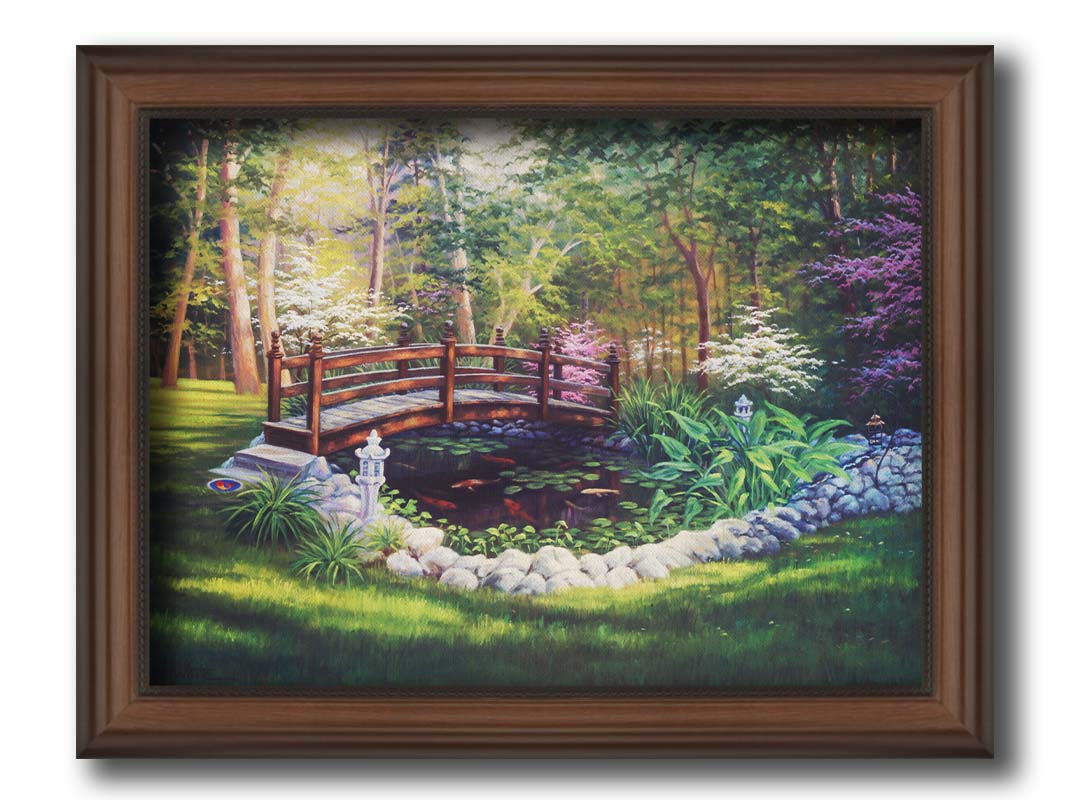 A painting of a garden koi pond, surrounded by stones and crossed by a small bridge. Lily pads grow in the water, and orange and white koi carp swim between them. Printed on canvas and framed.