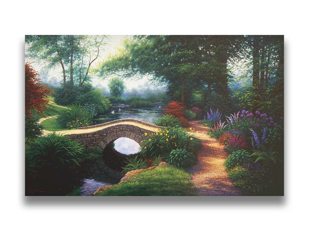 A painting of a serene garden path winding between flowers and trees. A stone bridge crosses over a tranquil pond inhabited by graceful swans. Printed on canvas.