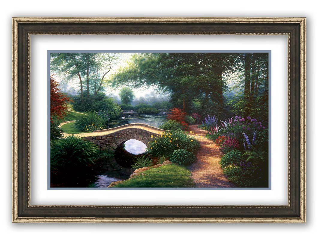 A painting of a serene garden path winding between flowers and trees. A stone bridge crosses over a tranquil pond inhabited by graceful swans. Printed on paper, matted, and framed.