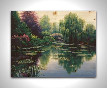 A painting of a pond filled with lily pads, surrounded by vibrant flowers and graceful willow trees. Printed on a wood pallet.