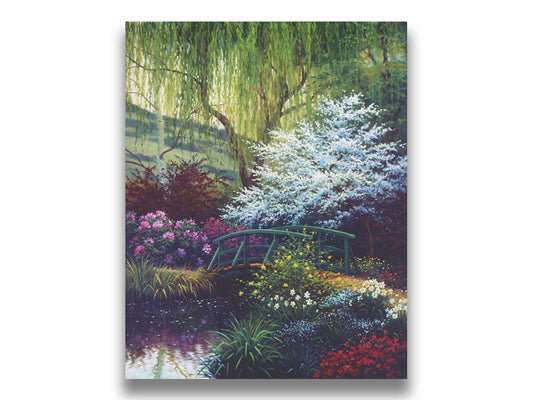 A painting of Claude Monet’s iconic water lily pond in Giverny, France, featuring a small bridge over the canal that brings water into the pond. It is surrounded by willow trees, trees with white and red blossoms, and a variety of flowers. Printed on canvas.