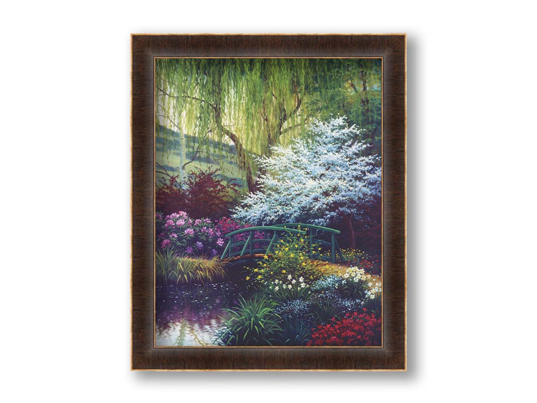 A painting of Claude Monet’s iconic water lily pond in Giverny, France, featuring a small bridge over the canal that brings water into the pond. It is surrounded by willow trees, trees with white and red blossoms, and a variety of flowers. Printed on canvas and framed.