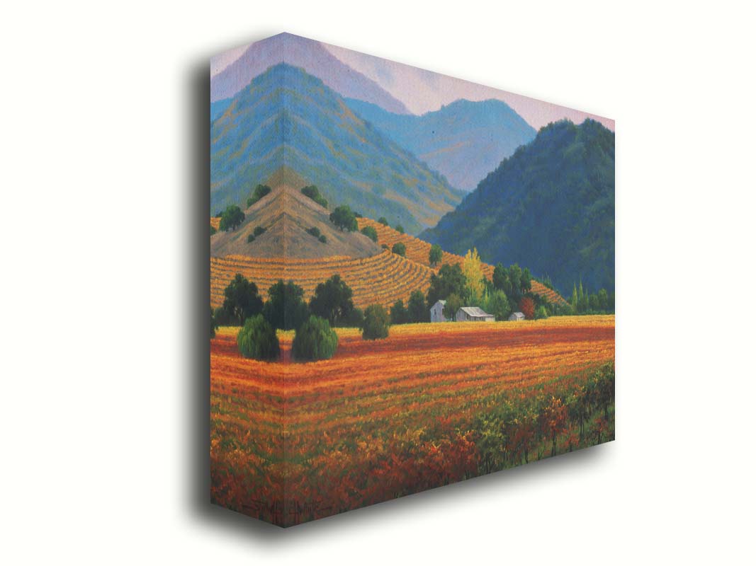 A landscape painting of the Napa Valley wine region in California. Colorful orange, red, and green vineyards are nestled among forested mountains. Printed on canvas.