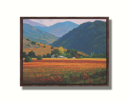 A landscape painting of the Napa Valley wine region in California. Colorful orange, red, and green vineyards are nestled among forested mountains. Printed on canvas in a float frame.