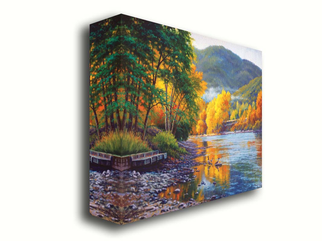 A landscape painting of the vibrant orange and yellow trees of the Rogue River in Oregon, with a few geese waddling in the shallows by the rocky shore. Printed on canvas.