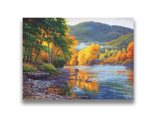 A landscape painting of the vibrant orange and yellow trees of the Rogue River in Oregon, with a few geese waddling in the shallows by the rocky shore. Printed on canvas.