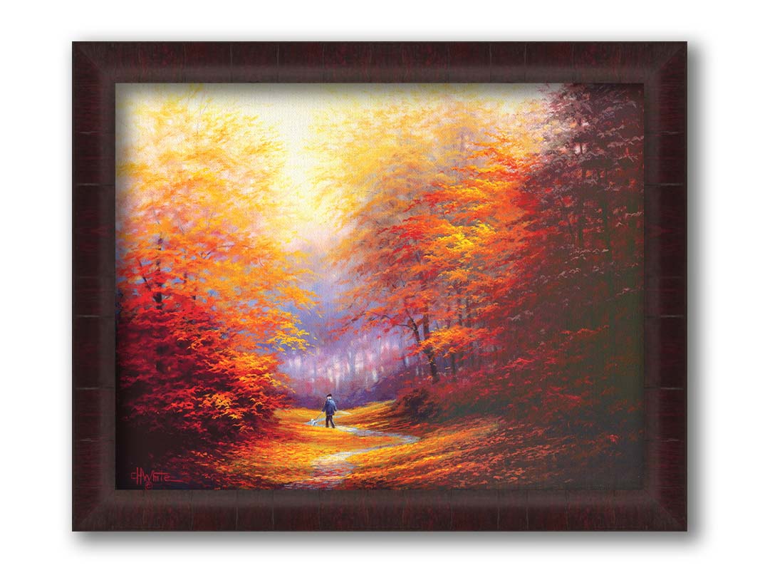 A painting of resplendent orange and red trees, a winding sidewalk through the woods, and a person walking their dog along the path. Printed on canvas and framed.