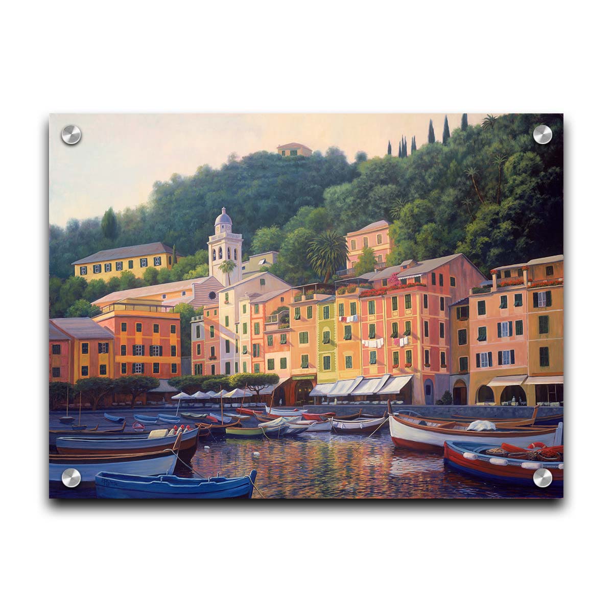 A painting of the colorful fishing town of Portofino. Many small boats are docked in the waters in the foreground, and the steep hills in the background are lush with trees. Printed on acrylic.