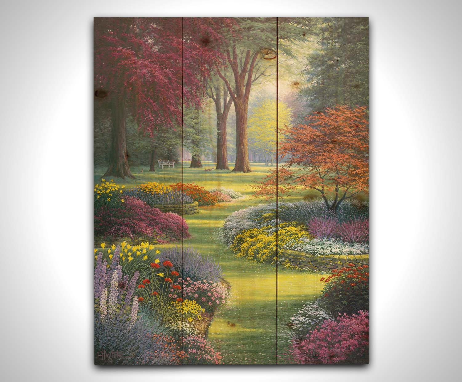 A painting of a garden with flowerbeds filled with pink, purple, yellow, and white flowers. Trees such as Japanese maples add to the colorful nature of the park with their red and purple leaves. Printed on a wood pallet.