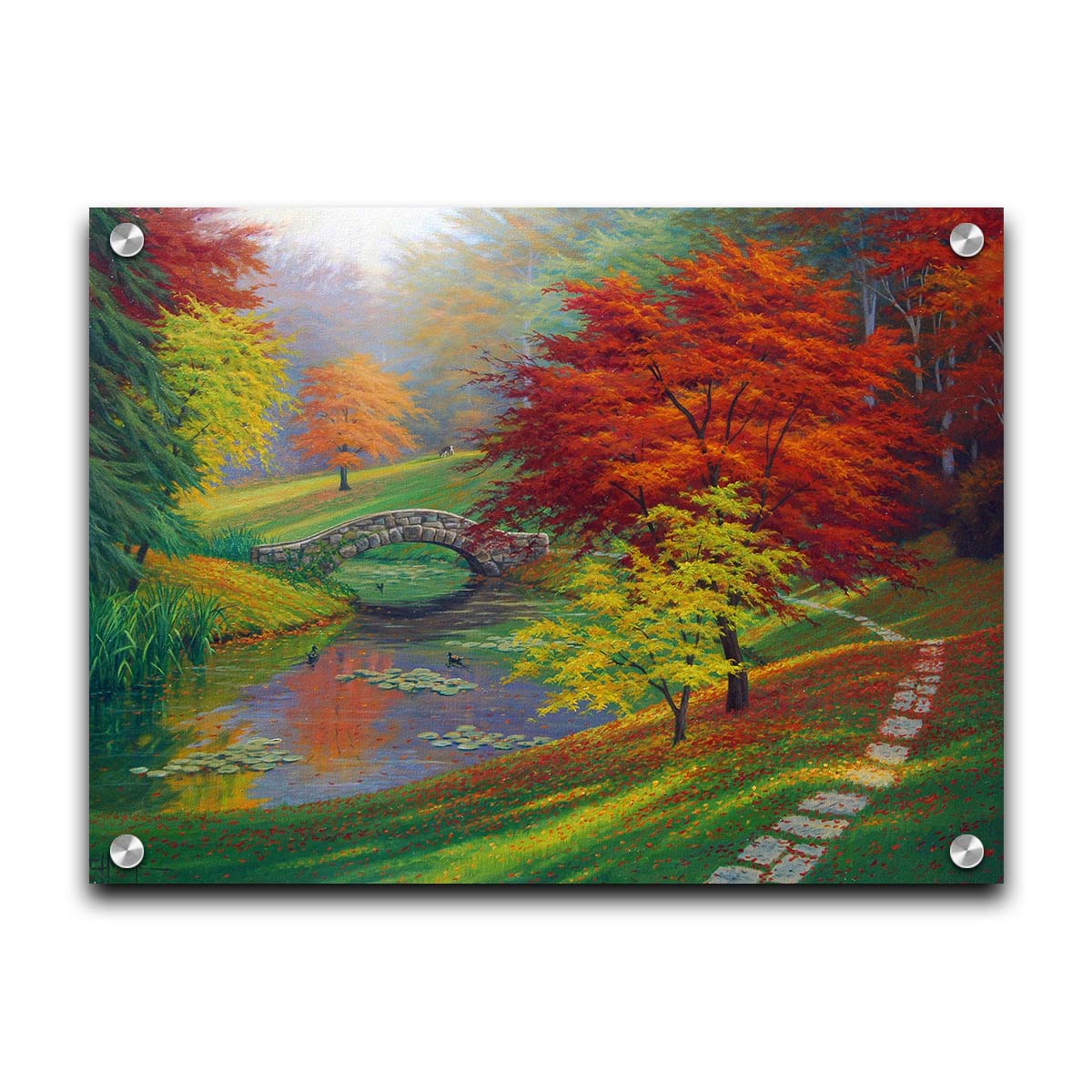 A painting of a fall park scene. Vibrant trees in hues of orange and red adorn the landscape while leaves gently fall. A stone bridge over a pond with lily pads and ducks. Printed on acrylic.