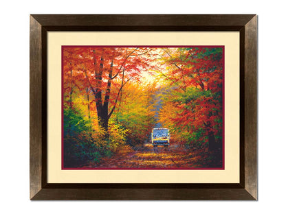 A painting of a road through the fall woods, with colorful leaves. A Schwan's food delivery truck drives away down the road. Printed on paper, matted, and framed.