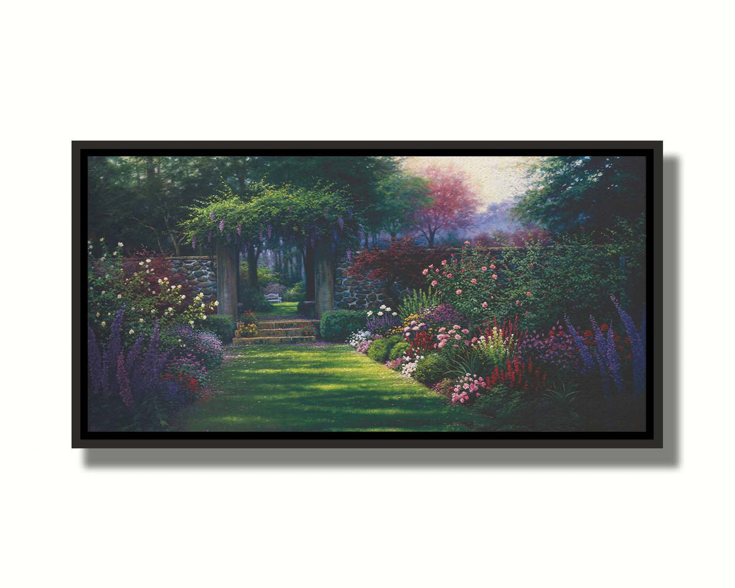 This painting depicts a grassy path leading through a tranquil garden filled with roses, carnations, lavender, and wisteria. The arch through the stone wall reveals a hidden grove of trees with a bench underneath. Printed on canvas in a float frame.