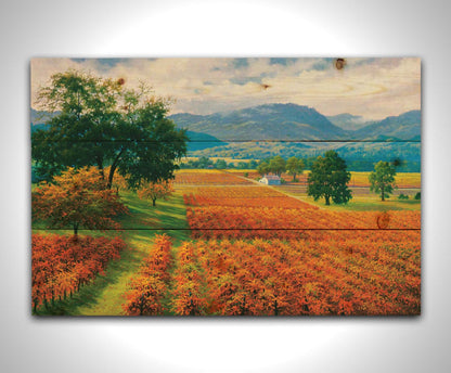 A painting of Napa Valley, California vineyards. The vibrant orange crops against the lush green grass create a picturesque landscape. Printed on a wood pallet.