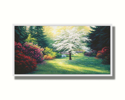 A painting of a park during a spring morning. Bushes and trees are blossoming with colorful flowers, and dark deep evergreens which contrast the warm morning light. Printed on canvas in a float frame.