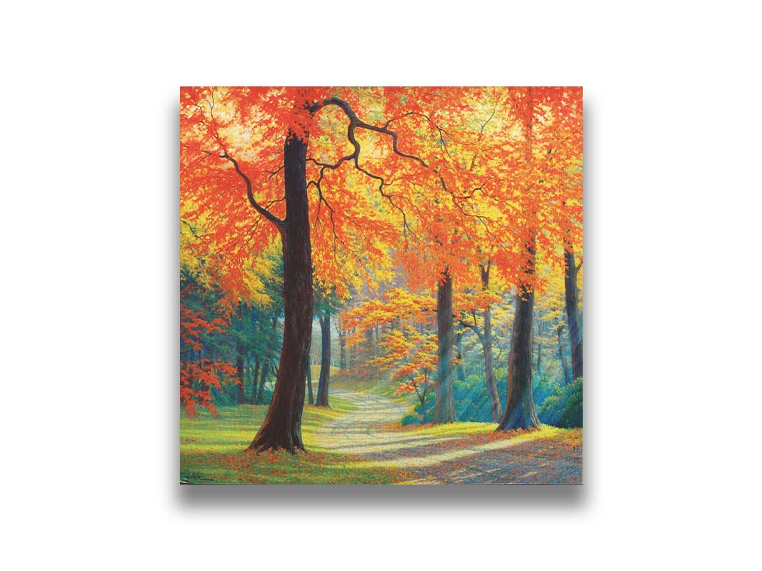 A painting of a gravel road through a fall forest. Sunbeams shine through evergreens and vibrant orange trees. Printed on canvas.