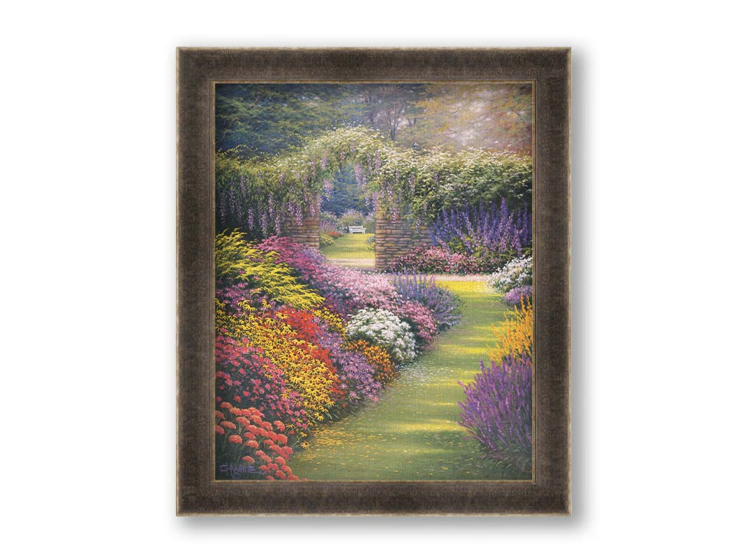 A painting of a garden path surrounded by flower bushes. The amalgam of colors leads to an archway in a stone wall, revealing a second garden area. Printed on canvas and framed.