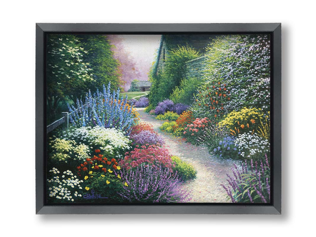 A painting of a gravel path through a garden with dense, colorful growths of flowers. The path and garden borders lead to cozy cottages. Printed on canvas and framed.