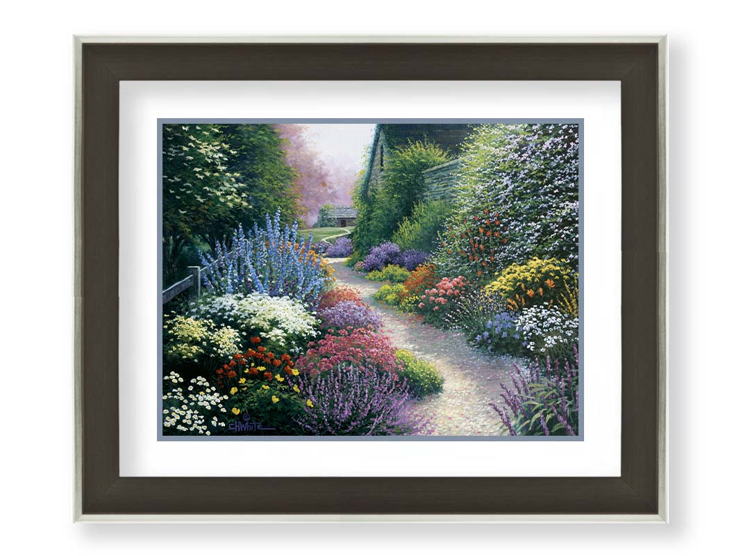 A painting of a gravel path through a garden with dense, colorful growths of flowers. The path and garden borders lead to cozy cottages. Printed on paper, matted, and framed.