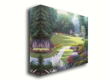 A painting of a sunny park. The open space of the grassy lawn is bordered by an abundance of colorful flowers and surrounding by trees. Printed on canvas.