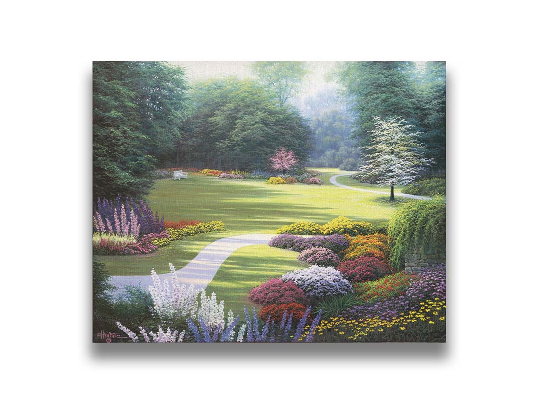 A painting of a sunny park. The open space of the grassy lawn is bordered by an abundance of colorful flowers and surrounding by trees. Printed on canvas.