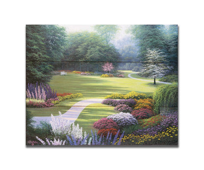 A painting of a sunny park. The open space of the grassy lawn is bordered by an abundance of colorful flowers and surrounding by trees. Printed on a box board.