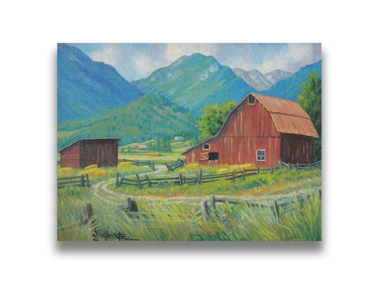 A painting of a red barn and shed surrounded by green pastures. Forested mountains stand tall in the background. Printed on canvas.