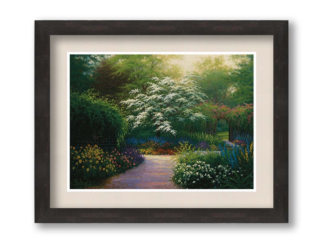 A painting of a brick wall surrounding a flower garden in a full spectrum of colors. A tree blossoming white stands central in contrast to the colorful scene. Printed on paper, matted, and framed.