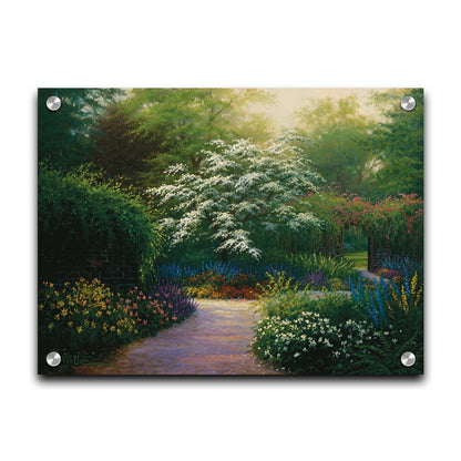 A painting of a brick wall surrounding a flower garden in a full spectrum of colors. A tree blossoming white stands central in contrast to the colorful scene. Printed on acrylic.