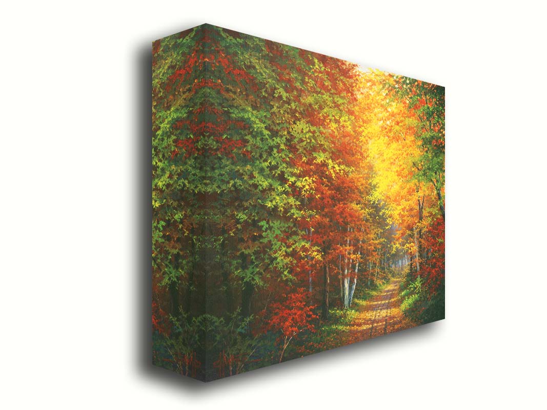 A painting of a leaf-strewn road through a forest, with light filtering through the branches to highlight the golden hues of fall. Printed on canvas.