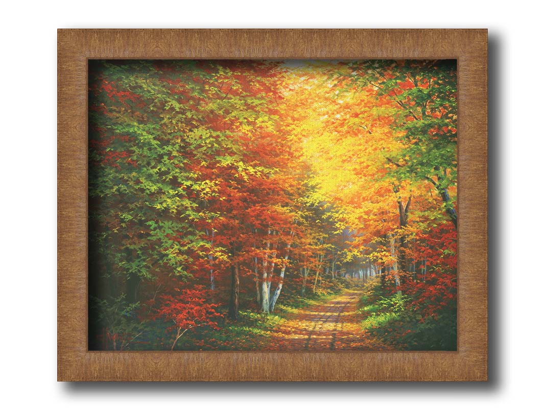 A painting of a leaf-strewn road through a forest, with light filtering through the branches to highlight the golden hues of fall. Printed on canvas and framed.