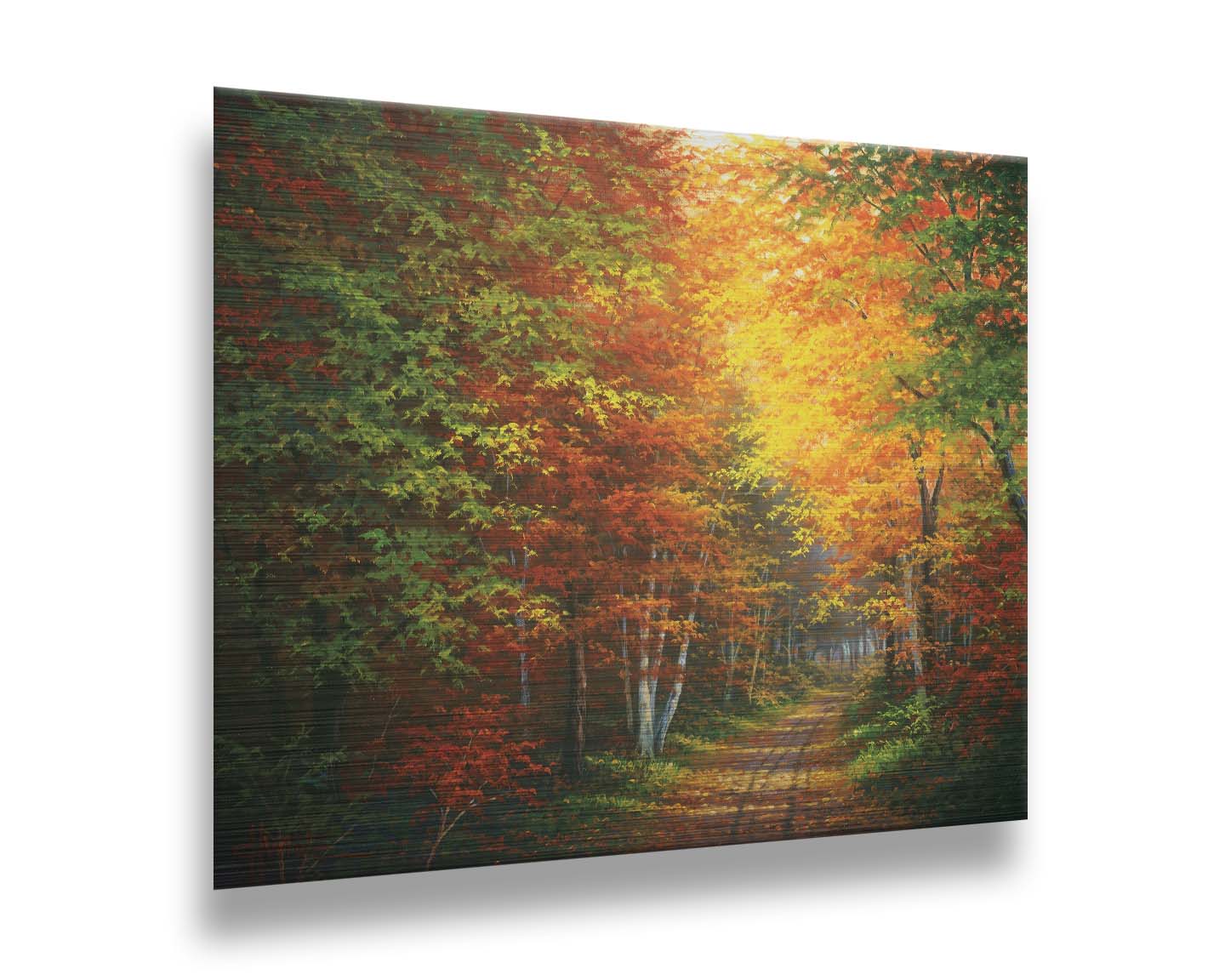 A painting of a leaf-strewn road through a forest, with light filtering through the branches to highlight the golden hues of fall. Printed on metal.