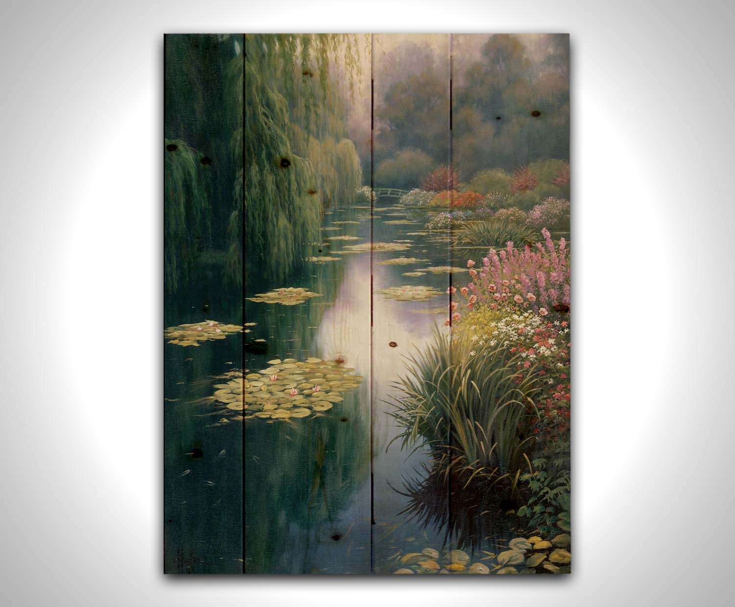 A painting of Claude Monet's garden pond in Giverny, France. Lily pads grow from the pond, and it is surrounded by willow trees and flower bushes. The famous green bridges often features in Monet's work can be seen across the pond. Printed on a wood pallet.