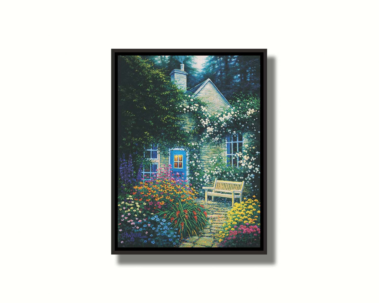 A painting of a cottage and stone path with a bench, all surrounded by colorful flower bushes and vines. Printed on canvas in a float frame.