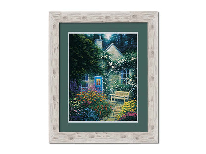 A painting of a cottage and stone path with a bench, all surrounded by colorful flower bushes and vines. Printed on paper, matted, and framed.