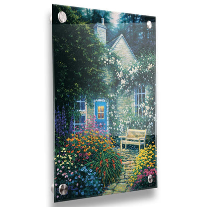 A painting of a cottage and stone path with a bench, all surrounded by colorful flower bushes and vines. Printed on acrylic.