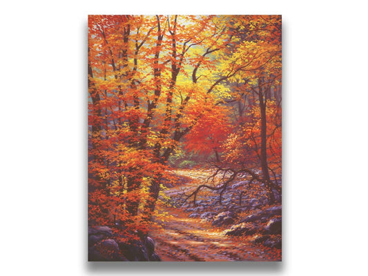 A painting of a fall scene, with a dirt and gravel road through the forest. The ground of the forest is rocky and coated in leaves. The trees are bright with orange and yellow. Printed on canvas.