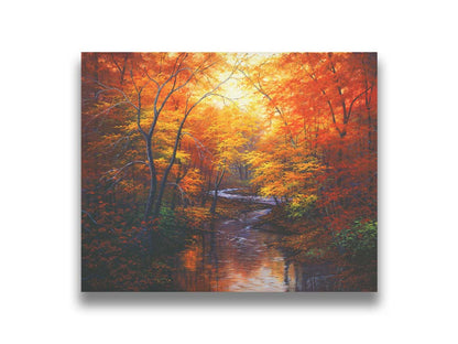 A painting of a stream through a forest in autumn. Warm hues dominate the scene, with red, orange, and yellow leaves and deep brown grasses and wood. Printed on canvas.