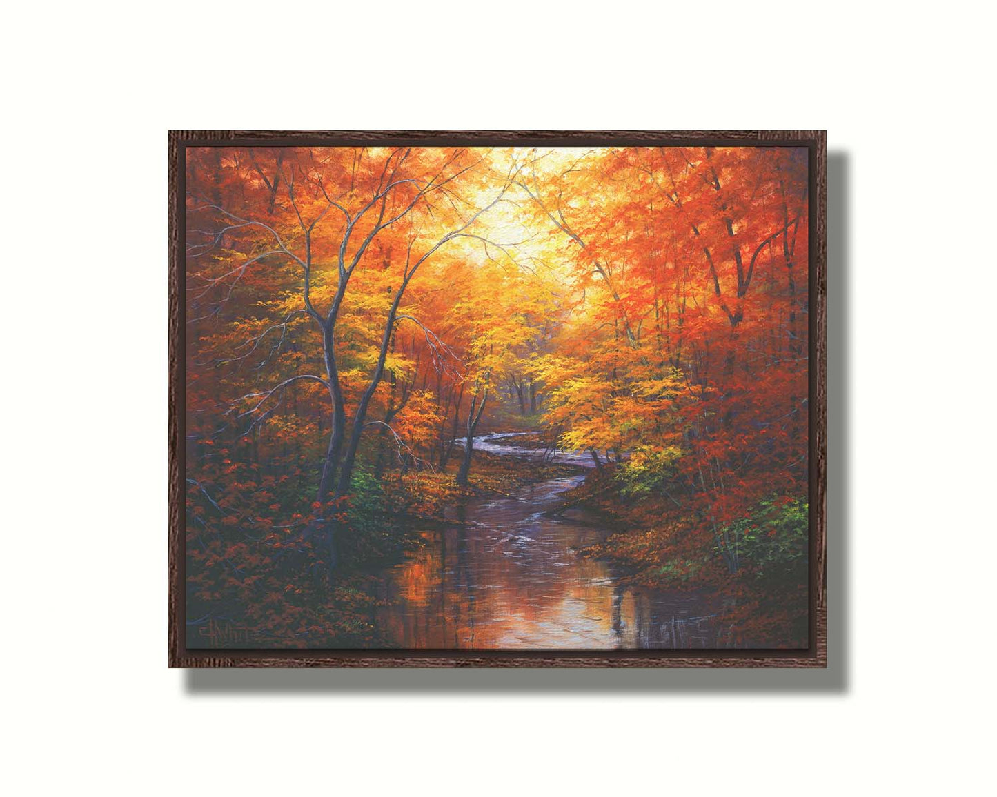 A painting of a stream through a forest in autumn. Warm hues dominate the scene, with red, orange, and yellow leaves and deep brown grasses and wood. Printed on canvas in a float frame.