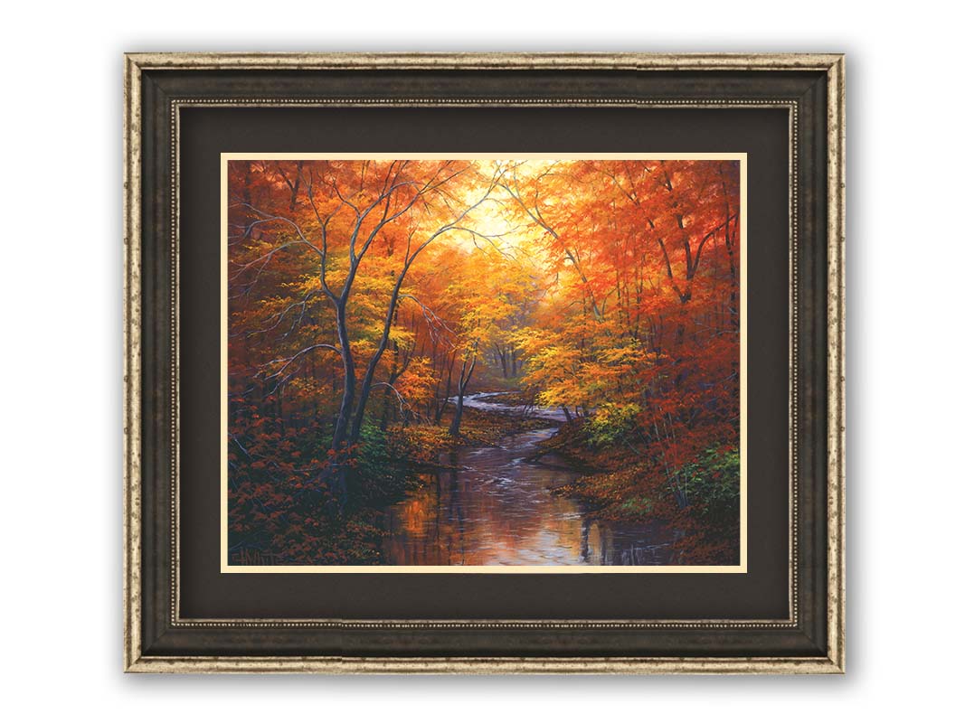 A painting of a stream through a forest in autumn. Warm hues dominate the scene, with red, orange, and yellow leaves and deep brown grasses and wood. Printed on paper, matted, and framed.