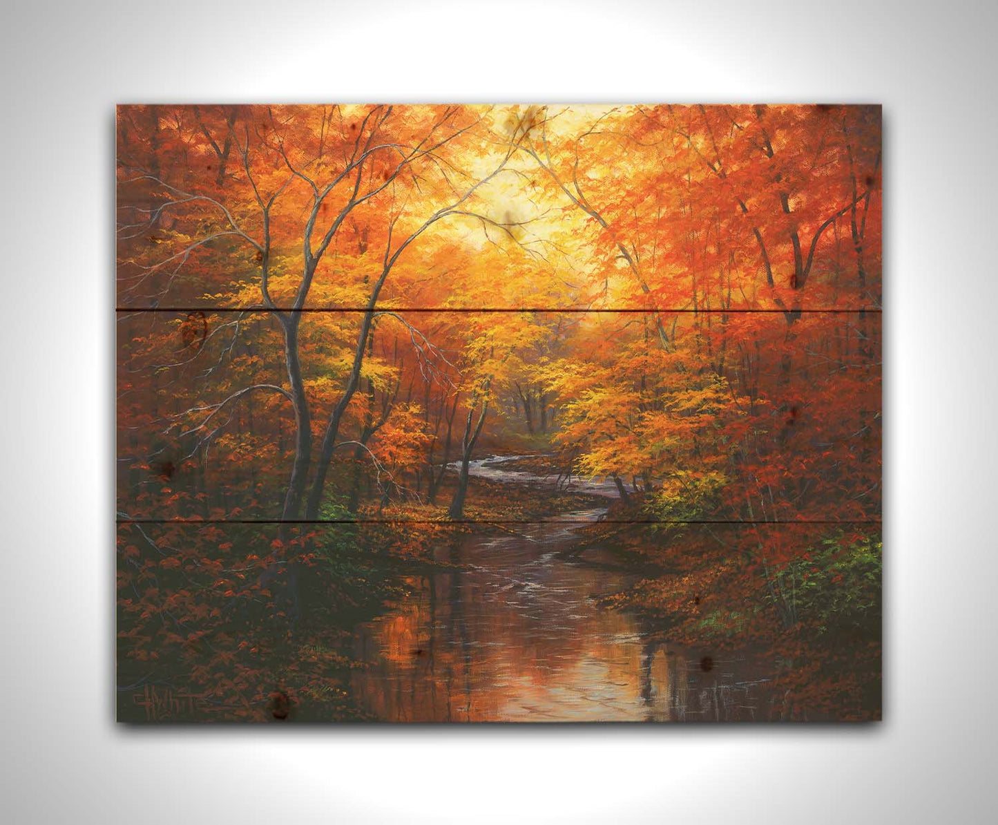 A painting of a stream through a forest in autumn. Warm hues dominate the scene, with red, orange, and yellow leaves and deep brown grasses and wood. Printed on a wood pallet.