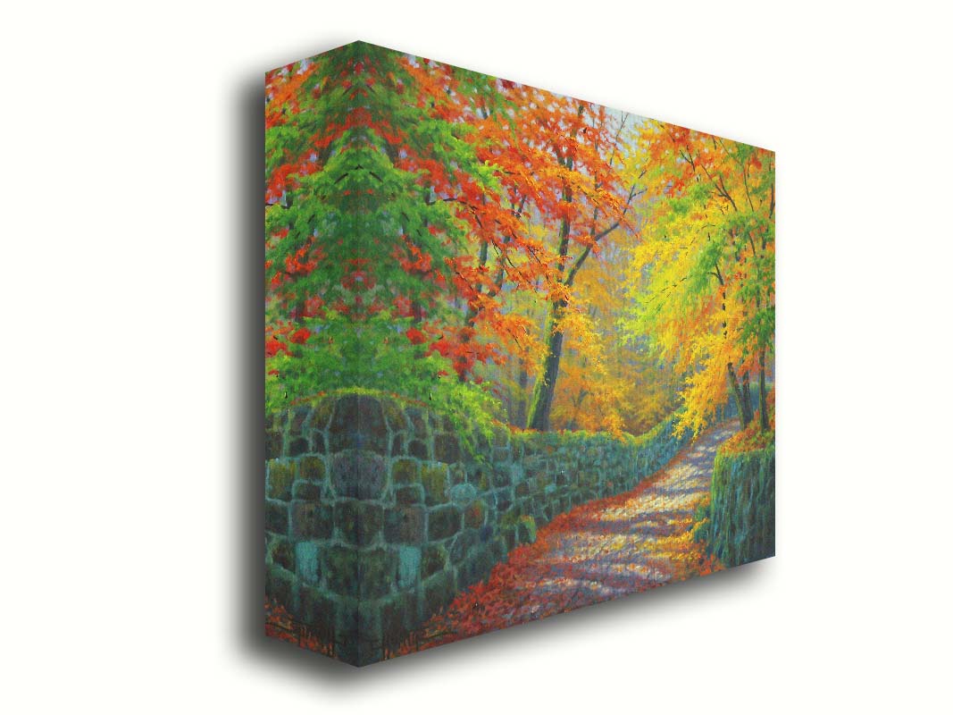 A painting of a stone road through a forest. It is bordered by stone walls on either side. The leaves of the trees are changing colors and dropping to the ground for fall. Printed on canvas.