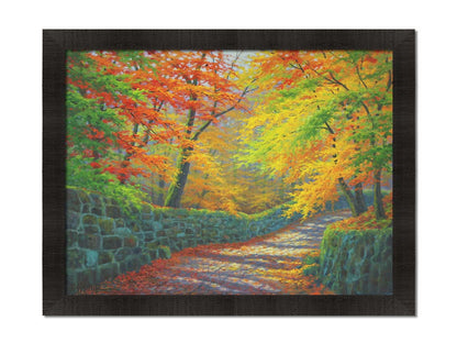 A painting of a stone road through a forest. It is bordered by stone walls on either side. The leaves of the trees are changing colors and dropping to the ground for fall. Printed on canvas and framed.